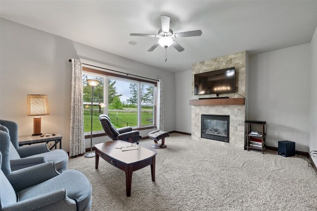 2913 Caspian Rd, Hiawatha, IA 52233 - living room with carpet floors, a fireplace, ceiling fan, and baseboards