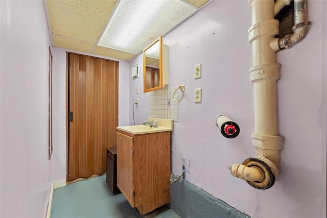 405 6th Ave, Clarence, IA 52216 - bathroom with vanity and a paneled ceiling