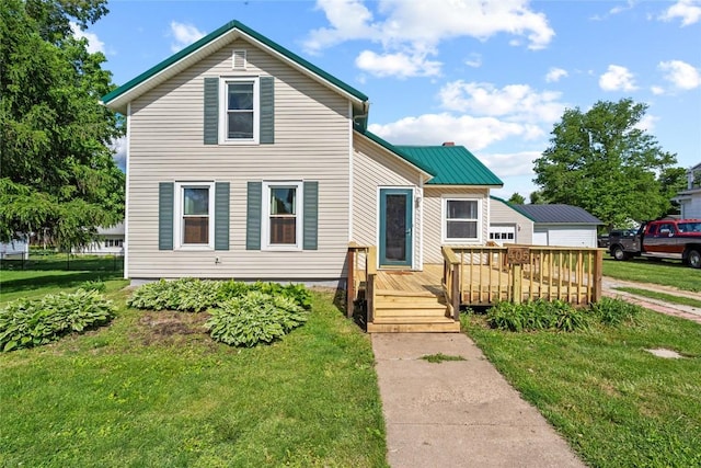 405 6th Ave, Clarence, IA 52216 - traditional home with a front yard and a wooden deck