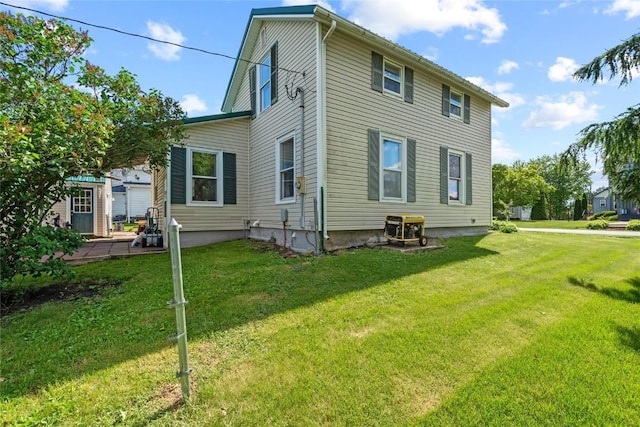 405 6th Ave, Clarence, IA 52216 - back of house featuring a yard