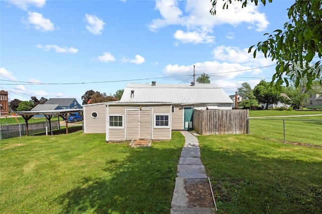 405 6th Ave, Clarence, IA 52216 - rear view of house with metal roof