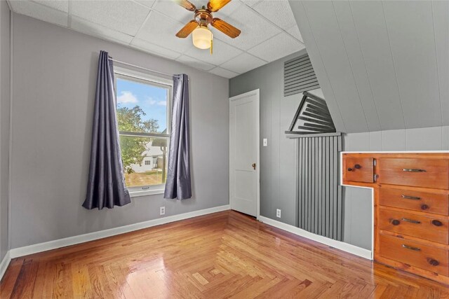 405 6th Ave, Clarence, IA 52216 - unfurnished bedroom with a paneled ceiling and ceiling fan