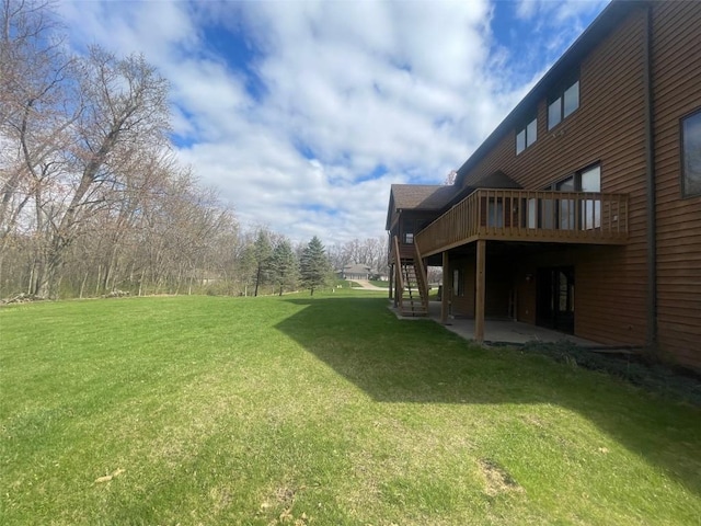 1354 Fox Meadow Ct NE, Swisher, IA 52338 - view of green lawn with stairway, a deck, and a patio