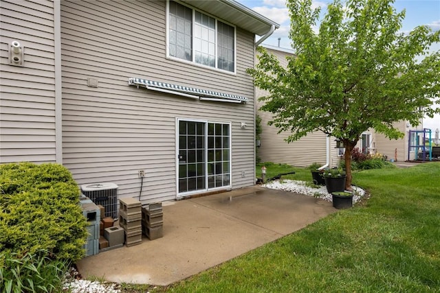 80 Florence Way, North Liberty, IA 52317 - rear view of house featuring a patio, a yard, and central AC unit