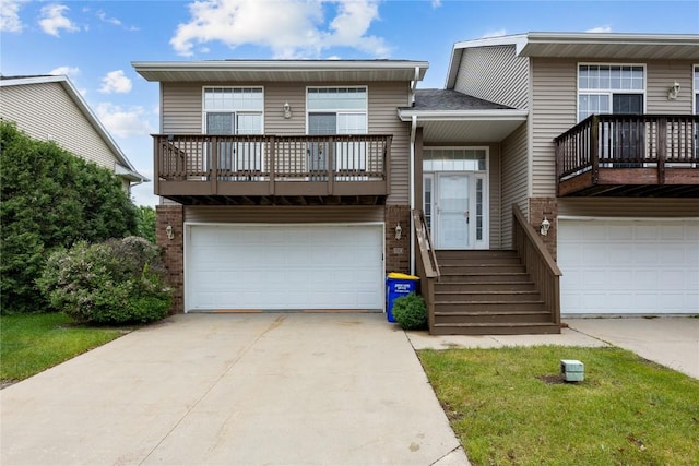 80 Florence Way, North Liberty, IA 52317 - view of front of home featuring a balcony, a garage, and brick siding