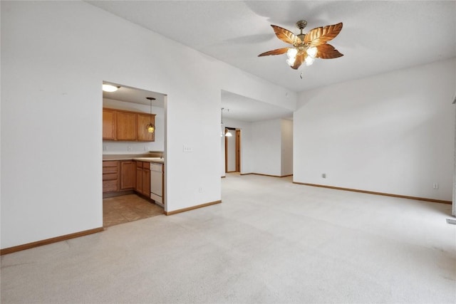 80 Florence Way, North Liberty, IA 52317 - unfurnished living room featuring light carpet, a ceiling fan, baseboards, and a sink