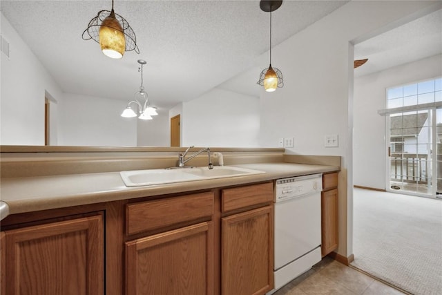 80 Florence Way, North Liberty, IA 52317 - kitchen featuring white dishwasher, a sink, decorative light fixtures, brown cabinetry, and light tile patterned floors