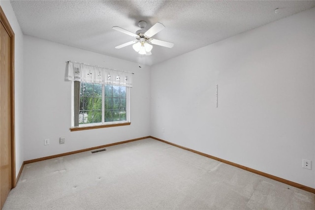 80 Florence Way, North Liberty, IA 52317 - empty room featuring carpet flooring, baseboards, a textured ceiling, and ceiling fan