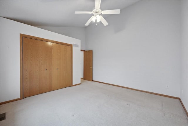 80 Florence Way, North Liberty, IA 52317 - unfurnished bedroom with vaulted ceiling, a closet, light colored carpet, baseboards, and ceiling fan