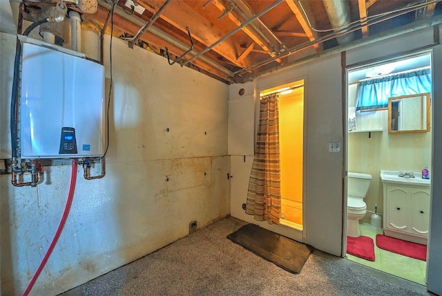 1139 H Ave NE, Cedar Rapids, IA 52402 - below grade area with water heater, carpet, and a sink