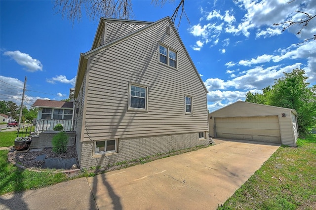 1139 H Ave NE, Cedar Rapids, IA 52402 - view of property exterior with an outdoor structure and a garage