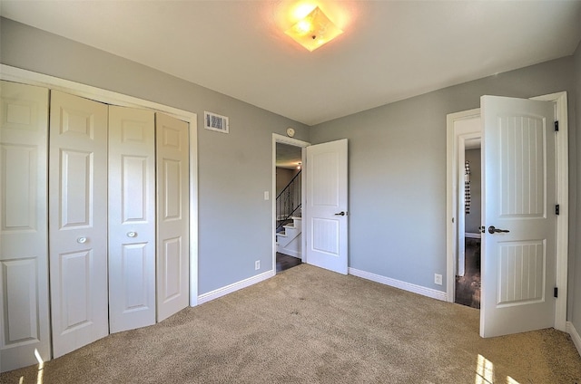 1139 H Ave NE, Cedar Rapids, IA 52402 - unfurnished bedroom with carpet, a closet, and baseboards