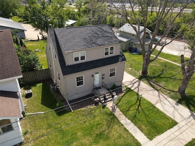 1139 H Ave NE, Cedar Rapids, IA 52402 - view of front of property with a shingled roof and central AC