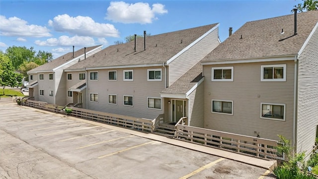 215 40th St Dr SE Unit 304, Cedar Rapids, IA 52403 - rear view of house with uncovered parking