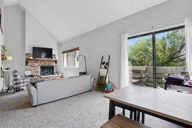 215 40th St Dr SE Unit 304, Cedar Rapids, IA 52403 - carpeted living area featuring a fireplace and high vaulted ceiling