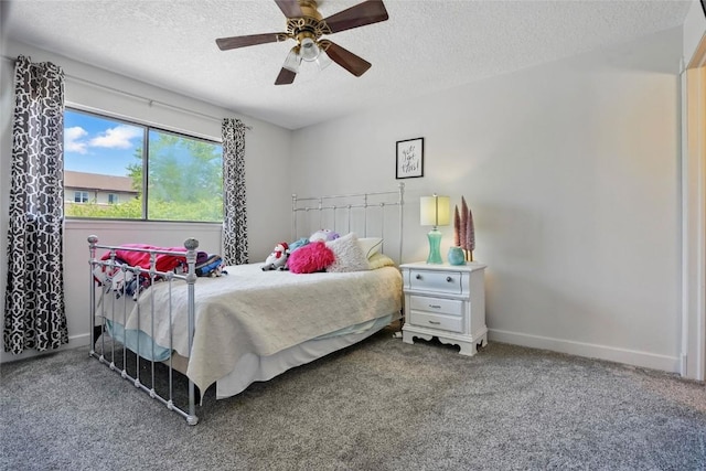 215 40th St Dr SE Unit 304, Cedar Rapids, IA 52403 - bedroom featuring a textured ceiling, carpet, baseboards, and a ceiling fan