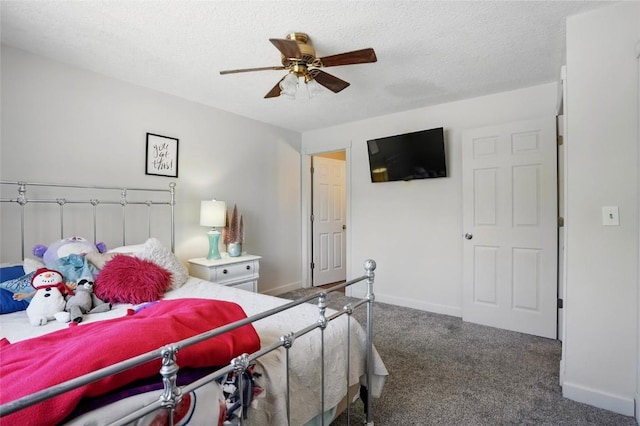 215 40th St Dr SE Unit 304, Cedar Rapids, IA 52403 - carpeted bedroom featuring a textured ceiling, baseboards, and ceiling fan
