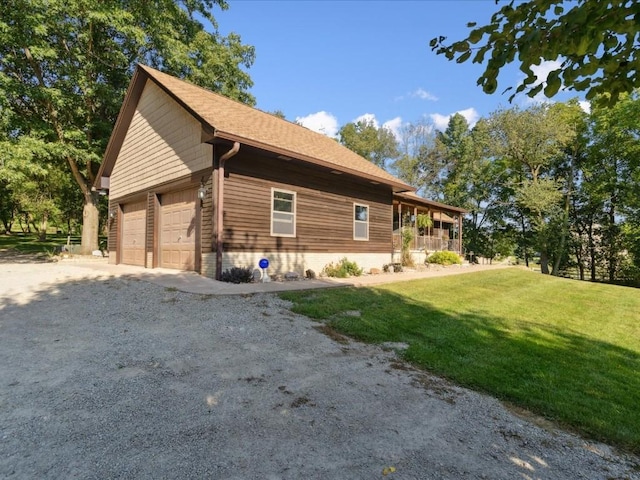 1901 42nd St SE, Cedar Rapids, IA 52403 - view of property exterior with a yard, a garage, and a porch