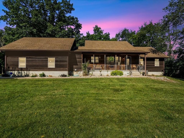 1901 42nd St SE, Cedar Rapids, IA 52403 - ranch-style home with covered porch, a lawn, and roof with shingles