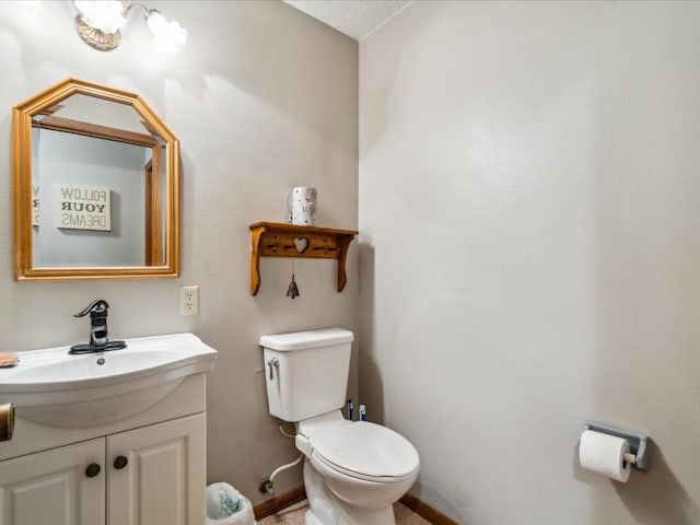 1901 42nd St SE, Cedar Rapids, IA 52403 - half bath featuring toilet, vanity, and baseboards