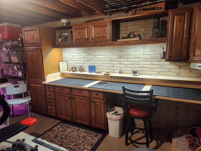 1901 42nd St SE, Cedar Rapids, IA 52403 - kitchen featuring open shelves and brown cabinets