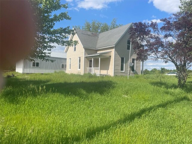 2902 Water St, Columbus City, IA 52737 - view of side of home with a shingled roof