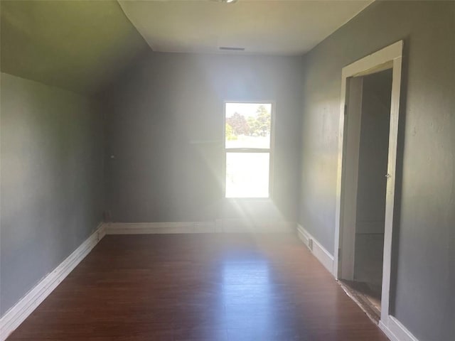 2902 Water St, Columbus City, IA 52737 - additional living space with wood finished floors, vaulted ceiling, and baseboards