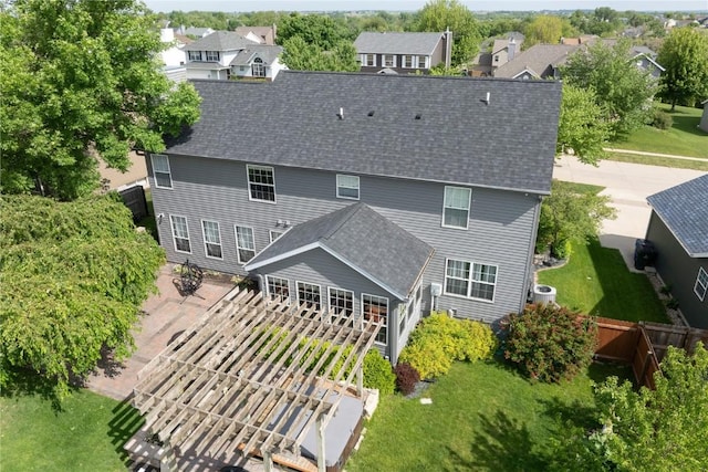 6919 Rockingham Dr SW, Cedar Rapids, IA 52404 - back of house featuring roof with shingles and a residential view