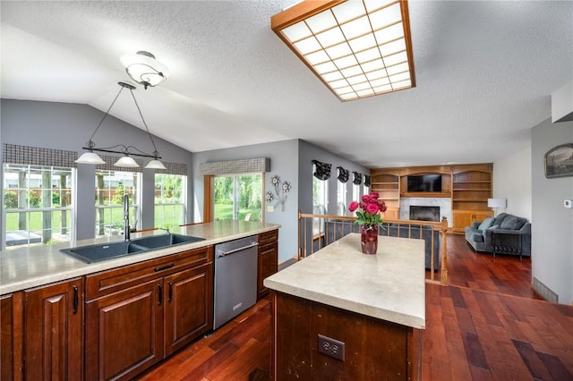6919 Rockingham Dr SW, Cedar Rapids, IA 52404 - kitchen with a sink, stainless steel dishwasher, dark wood-style floors, light countertops, and a textured ceiling