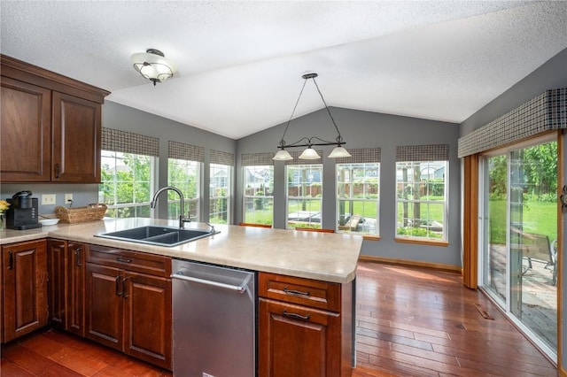 6919 Rockingham Dr SW, Cedar Rapids, IA 52404 - kitchen with a sink, a peninsula, dark wood-type flooring, light countertops, and vaulted ceiling