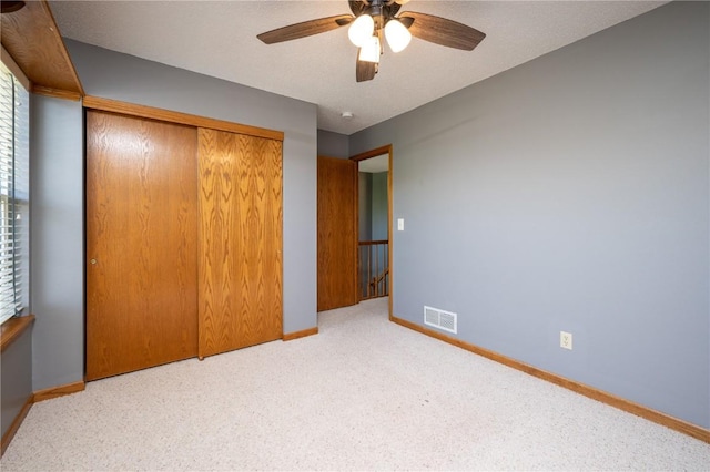 6919 Rockingham Dr SW, Cedar Rapids, IA 52404 - unfurnished bedroom with a closet, baseboards, carpet floors, and ceiling fan