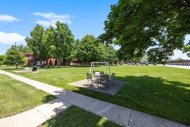 5712 Golden Ct NE Unit 60, Cedar Rapids, IA 52402 - surrounding community featuring a lawn and a patio