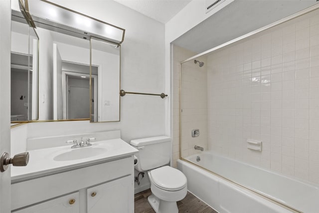 5712 Golden Ct NE Unit 60, Cedar Rapids, IA 52402 - bathroom with wood finished floors, toilet, vanity, and shower / bath combination