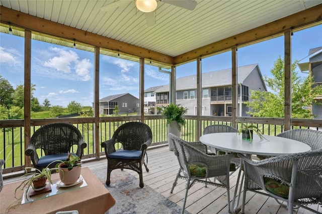 927 Summit Ct, Tiffin, IA 52340 - sunroom / solarium featuring ceiling fan, outdoor dining space, and a residential view