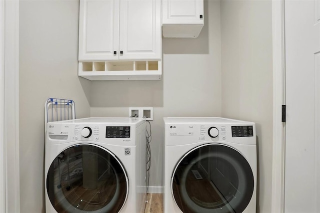 927 Summit Ct, Tiffin, IA 52340 - washroom featuring washing machine and clothes dryer and cabinet space
