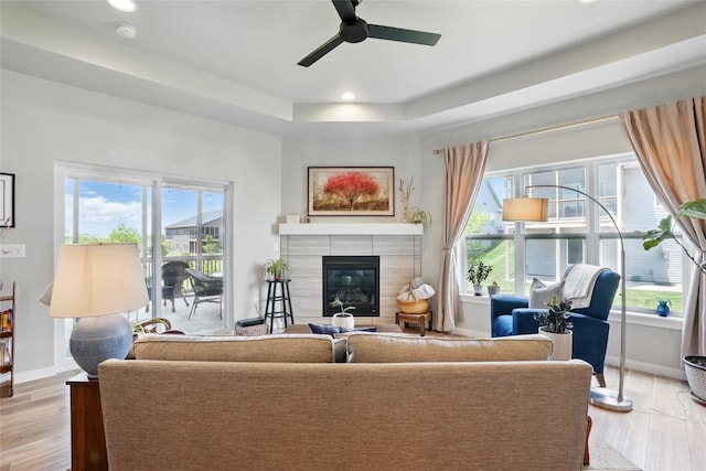 927 Summit Ct, Tiffin, IA 52340 - living area with plenty of natural light, ceiling fan, recessed lighting, a fireplace, and light wood-style floors