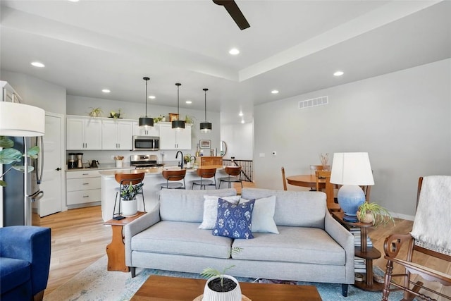927 Summit Ct, Tiffin, IA 52340 - living room featuring recessed lighting, light wood finished floors, and ceiling fan