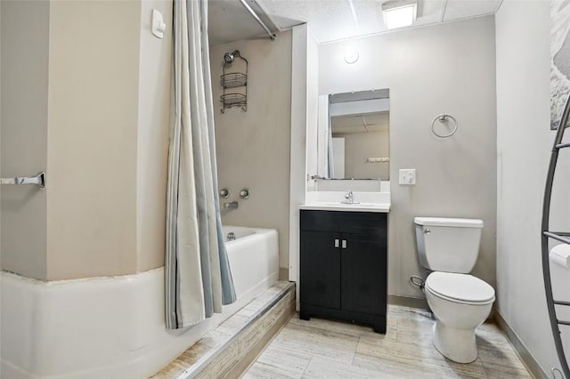 715 E Market St, Iowa City, IA 52245 - full bathroom featuring vanity, toilet, shower / bath combo with shower curtain, wood finished floors, and baseboards