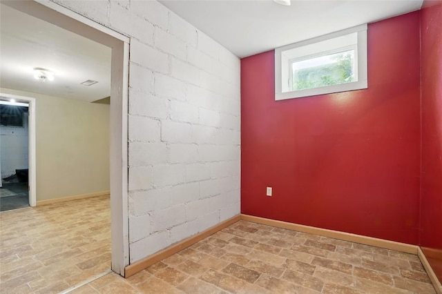 715 E Market St, Iowa City, IA 52245 - unfurnished room with baseboards and brick patterned flooring