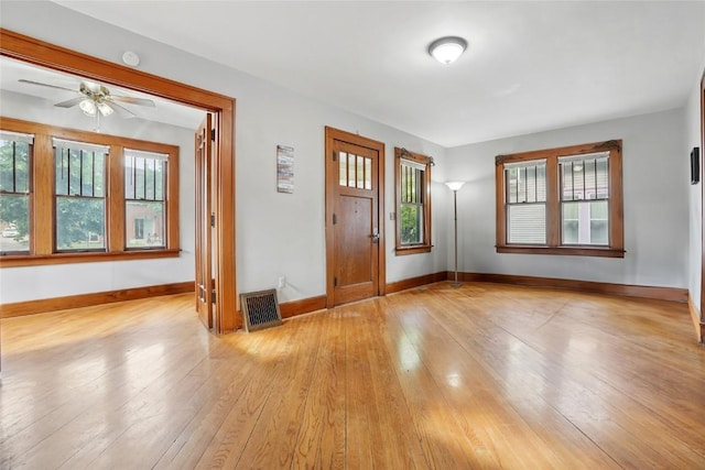715 E Market St, Iowa City, IA 52245 - foyer entrance featuring baseboards, light wood-style flooring, and ceiling fan
