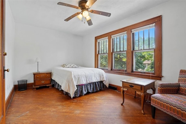 715 E Market St, Iowa City, IA 52245 - bedroom featuring wood finished floors, baseboards, and ceiling fan