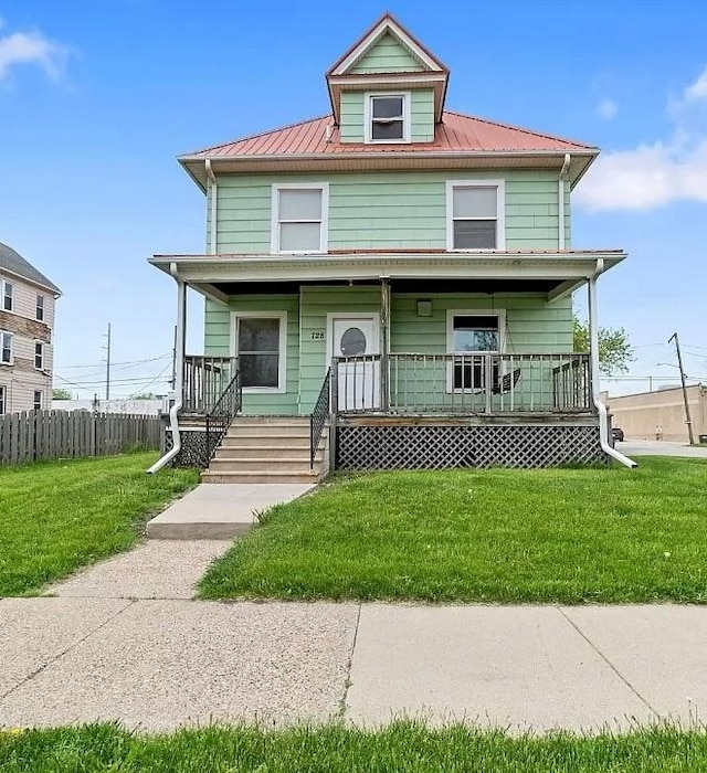728 4th Ave SE, Cedar Rapids, IA 52401 - american foursquare style home featuring a porch and metal roof