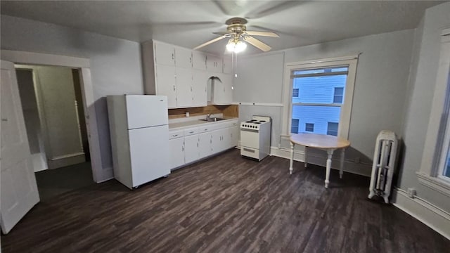 728 4th Ave SE, Cedar Rapids, IA 52401 - kitchen with white appliances, radiator, dark wood-style floors, and light countertops