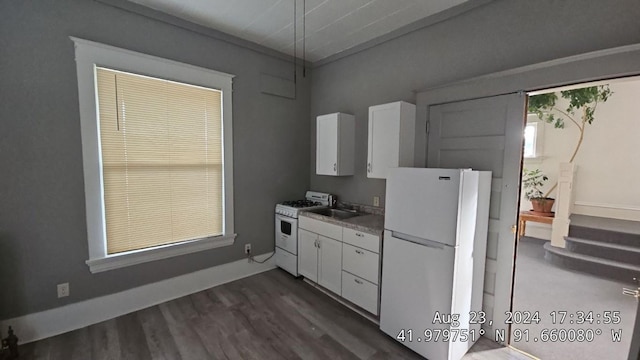 728 4th Ave SE, Cedar Rapids, IA 52401 - kitchen with white appliances, white cabinets, dark wood-style flooring, and a sink