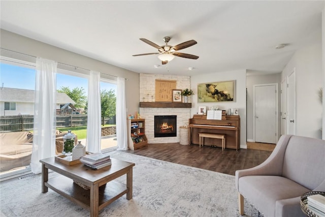 5150 Prairie Ridge Dr, Marion, IA 52302 - living room featuring a ceiling fan, wood finished floors, and a fireplace