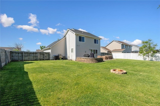 5150 Prairie Ridge Dr, Marion, IA 52302 - rear view of property featuring an outdoor fire pit