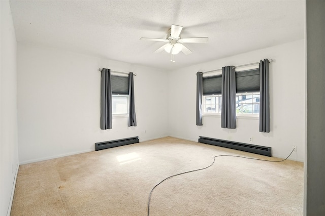 113 Chaffee Dr, Hiawatha, IA 52233 - carpeted spare room with a baseboard radiator, a ceiling fan, a textured ceiling, and baseboards