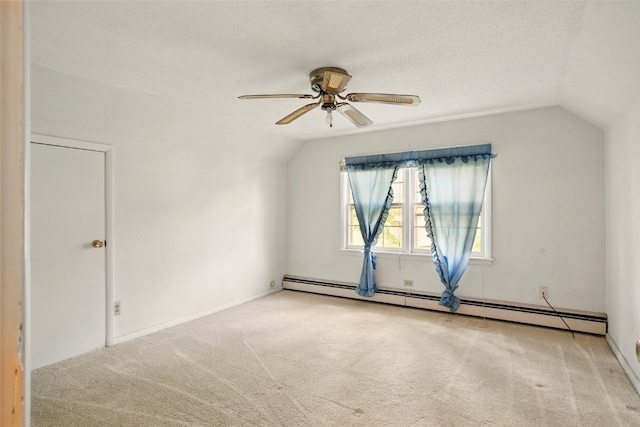 113 Chaffee Dr, Hiawatha, IA 52233 - unfurnished room featuring a baseboard heating unit, vaulted ceiling, carpet, a ceiling fan, and a textured ceiling