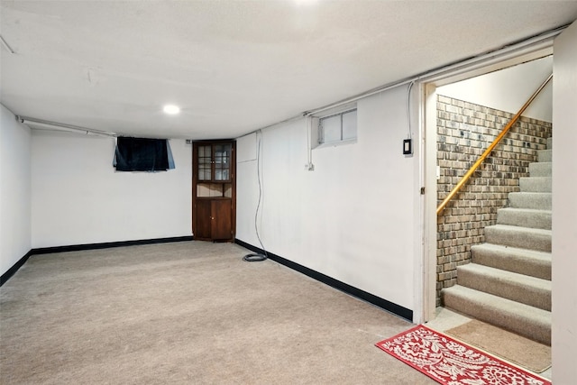 113 Chaffee Dr, Hiawatha, IA 52233 - finished below grade area featuring light colored carpet, baseboards, and stairway