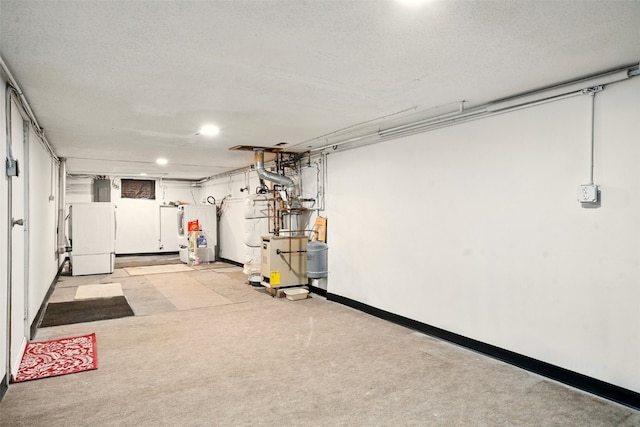 113 Chaffee Dr, Hiawatha, IA 52233 - garage with refrigerator, water heater, baseboards, and recessed lighting